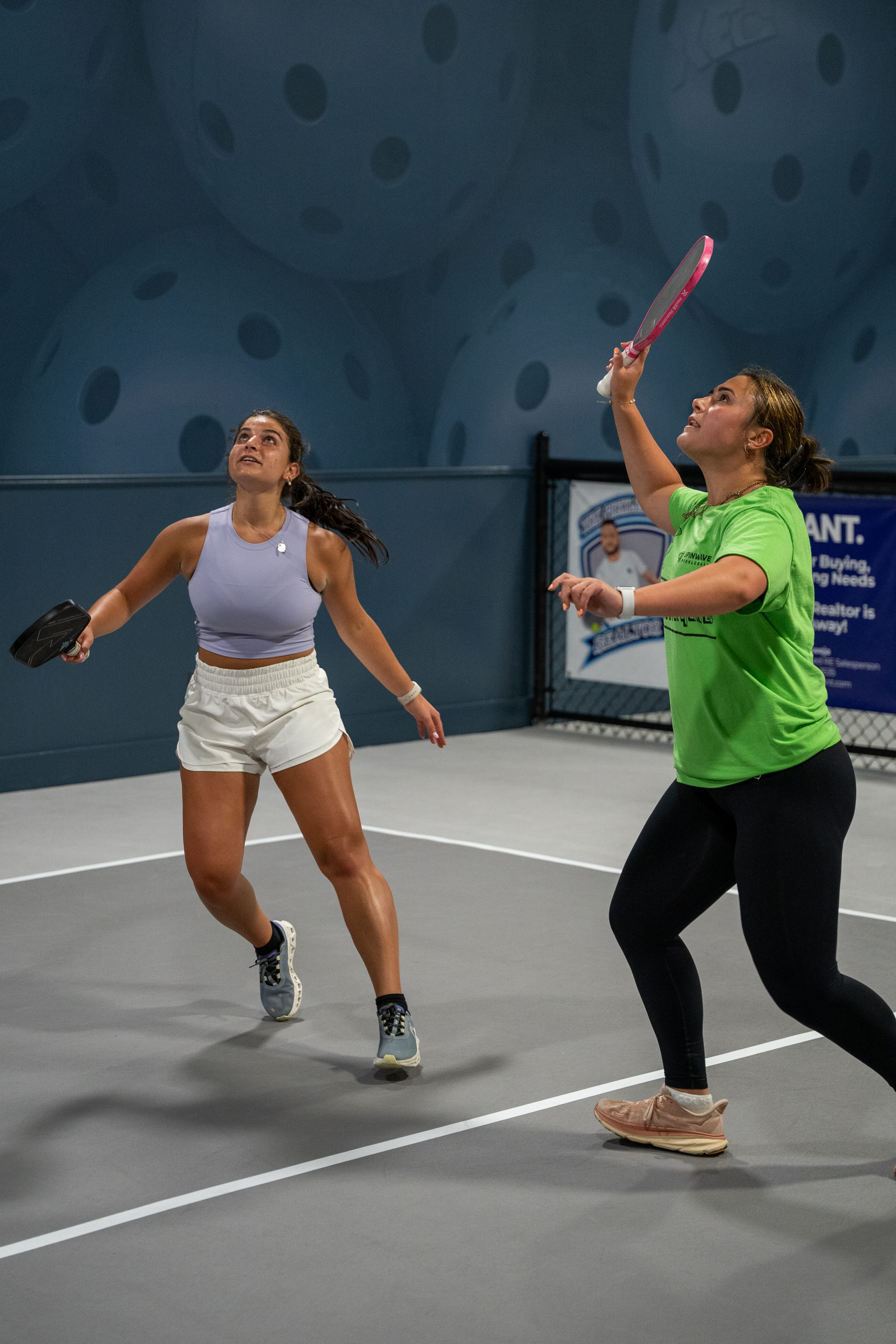 Two women playing pickleball at Pickleball Xpress